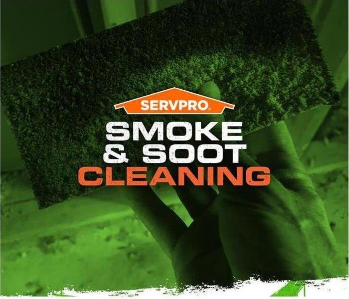 cloth wiping soot from a wall, SERVPRO logo